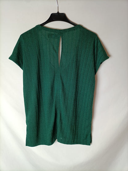 LEFTIES. Green ribbed top. T.S.