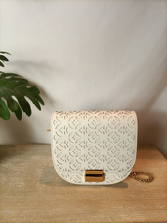 LOLA CRUZ. Die-cut white bag