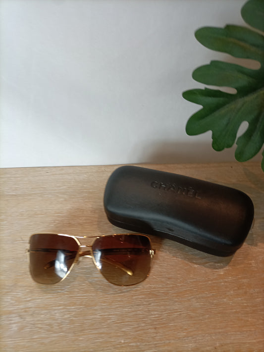 CHANEL. Gold-framed sunglasses