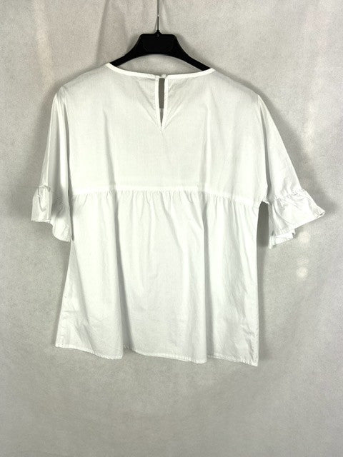 OTRAS.Blusa blanca flores bordadas T.s oversized