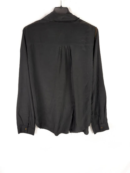 OTRAS. Blusa hombreras estrella T.u