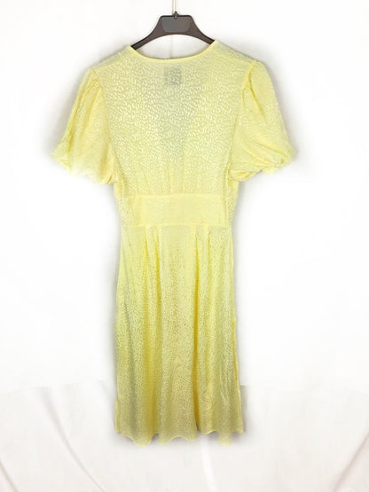 BERSHKA. Blusa larga amarillo animal print T.xs