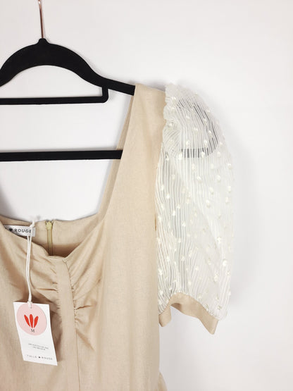 Red Tulle. Beige dress with transparent sleeves.