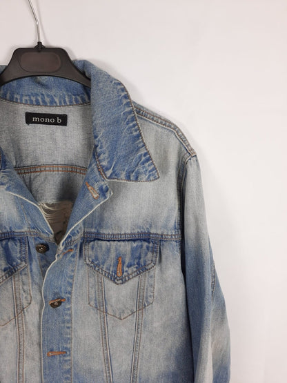 MONO B. cazadora vaquera espalda cruz rota T.U