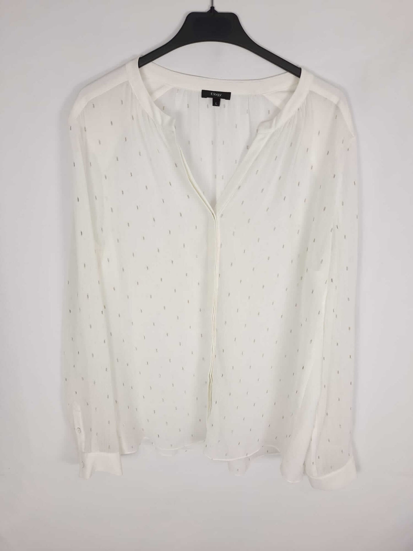 ELOGY.Blusa plumeti plateado T.L
