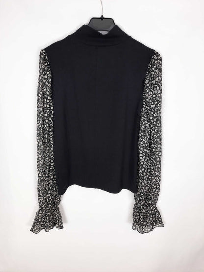 ZARA. Black double-textured sweater/top with floral print sleeves. Size m