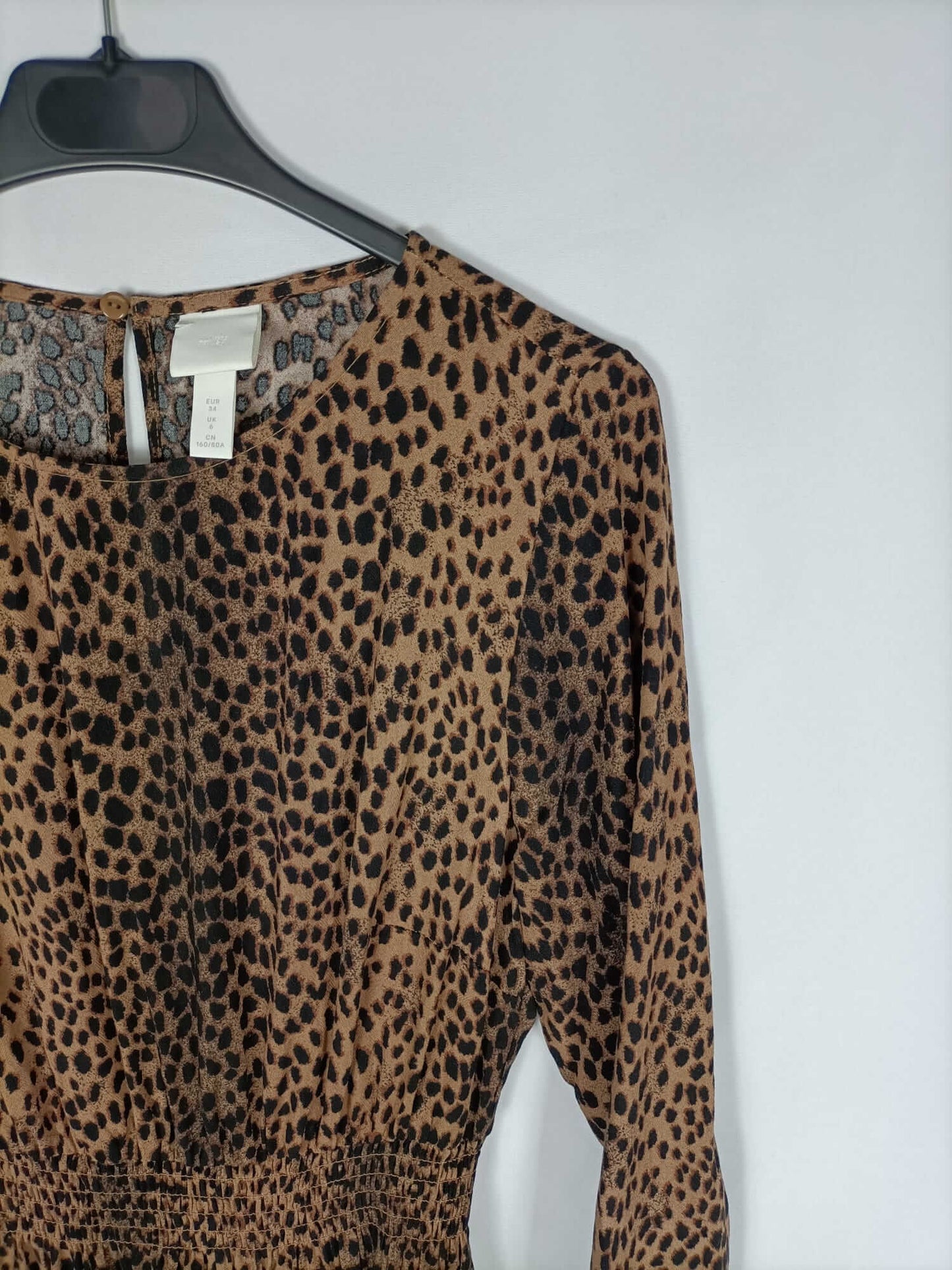 H&M. Vestido corto animal print T.34