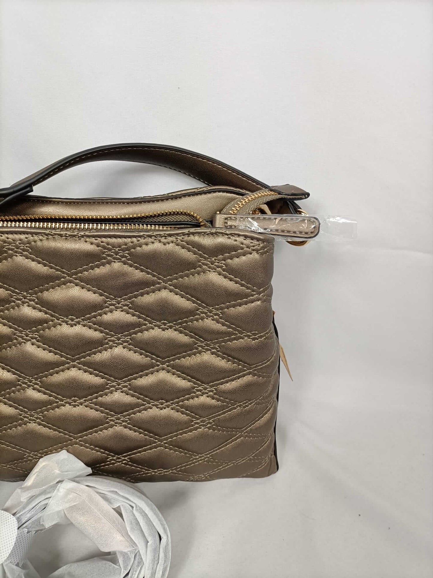ECI. Quilted bronze bag