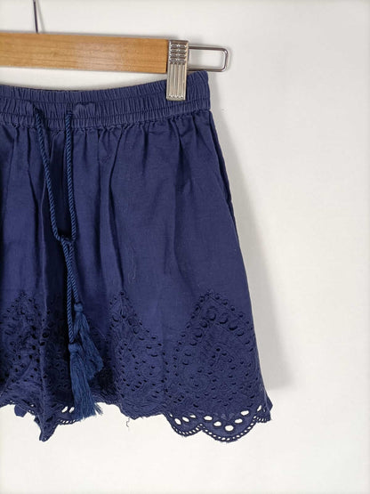 PRIMARK.Pantalón azul troquelado y bordado T.38