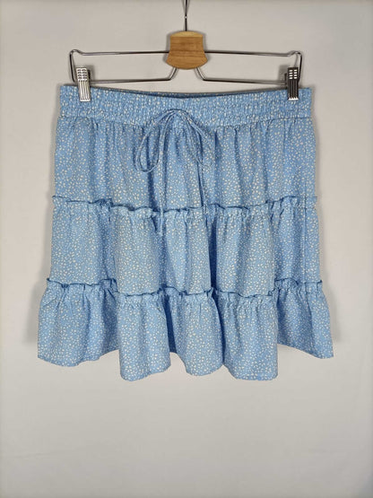 OTHERS. Short light blue floral skirt, size XL