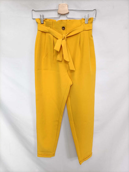 PRIMARK. Pantalón fluido amarillo T.32