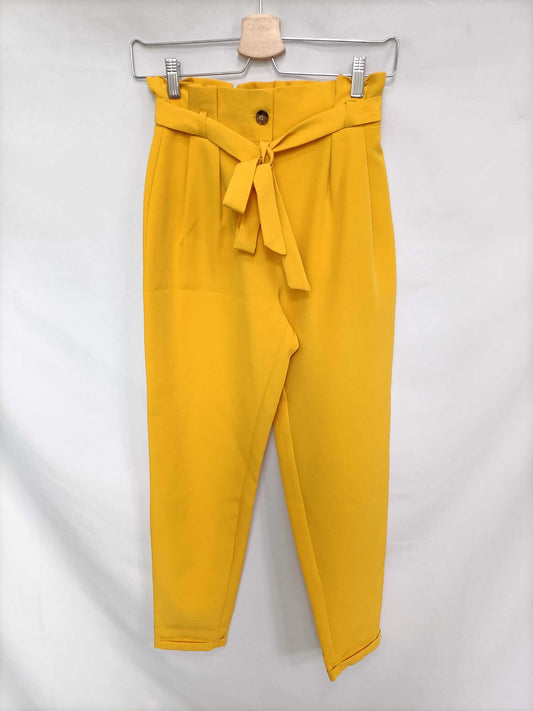 PRIMARK. Pantalón fluido amarillo T.32