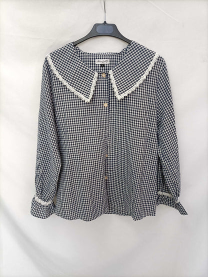 THE T-SHIRT. Gingham check blouse with a baby collar.