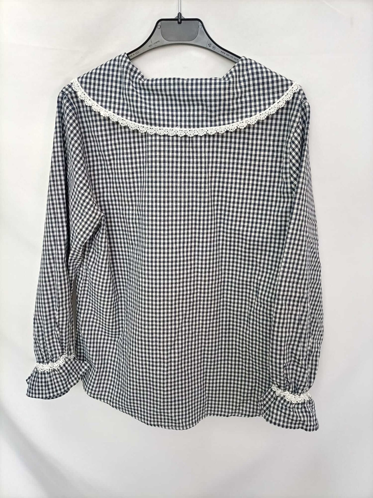 THE T-SHIRT. Gingham check blouse with a baby collar.