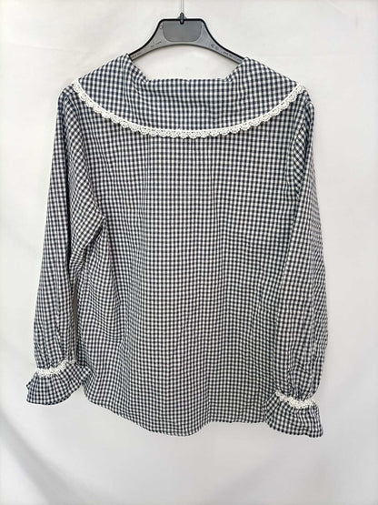 THE T-SHIRT. Gingham check blouse with a baby collar.