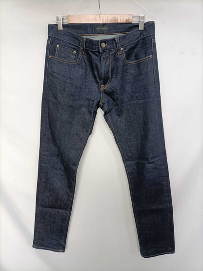 UNIQLO. Pantalón denim oscuro T.40