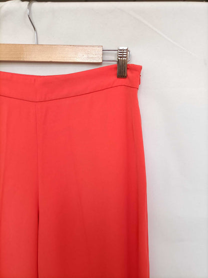 ZARA. Pantalón coral aperturas T.s