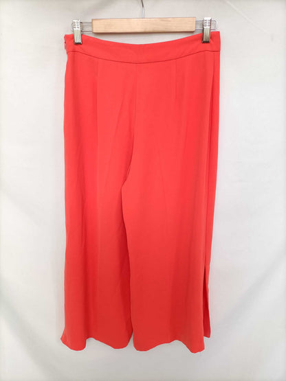 ZARA. Pantalón coral aperturas T.s