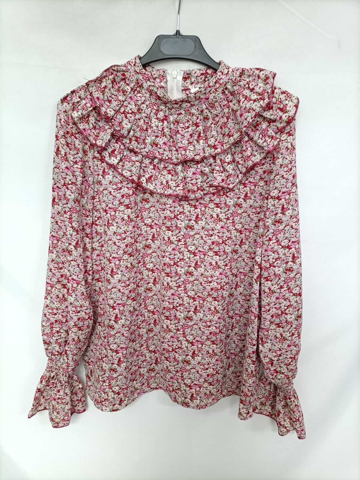 OTRAS. Blusa flores y volantes T.s