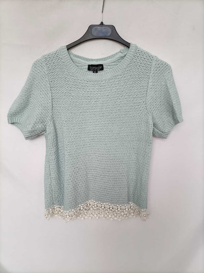 TOPSHOP. Top punto verde agua T.34