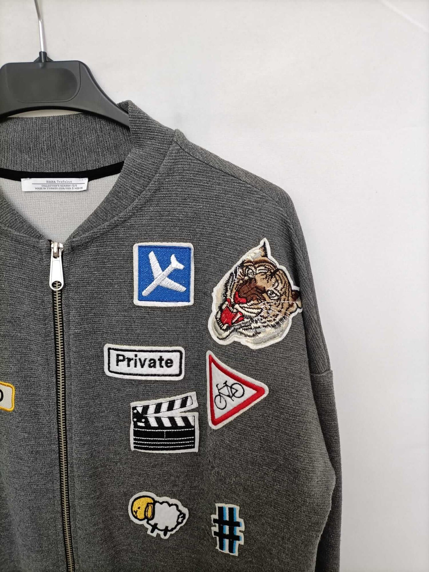 ZARA. Grey bomber jacket with Ts patches