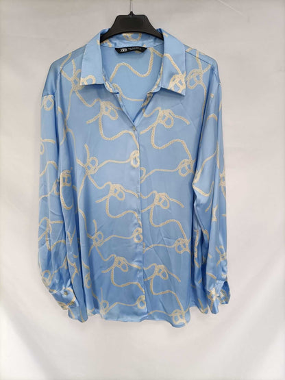 ZARA. Blusa celeste nudos T.xl