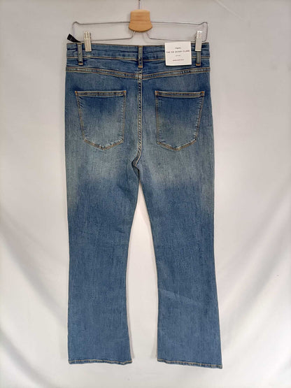 ZARA. Pantalón denim campana T.44