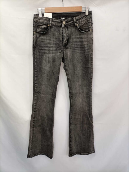 OTRAS.Pantalones denim campana negros T.L