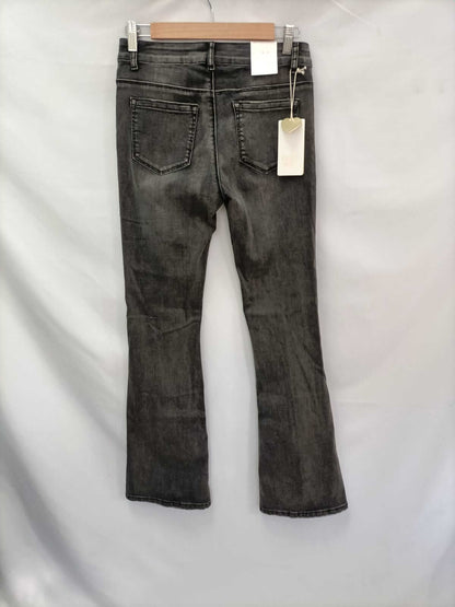 OTRAS.Pantalones denim campana negros T.L