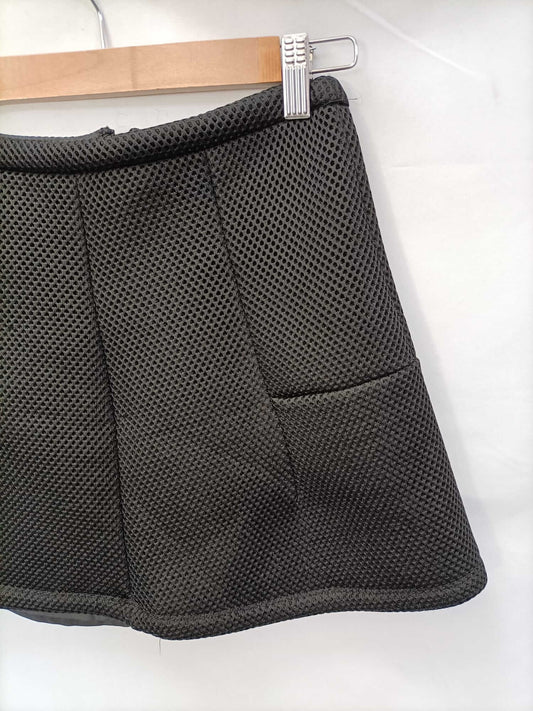 MANGO. Die-cut mini skirt T.34