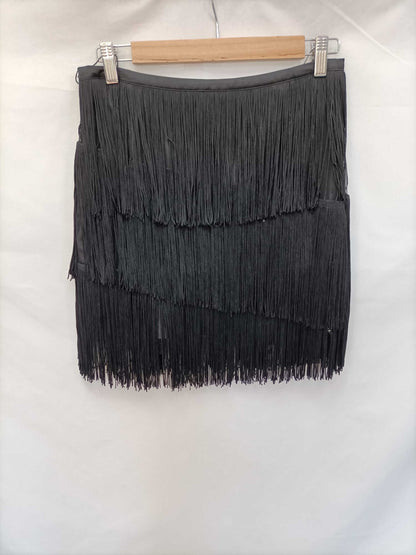 ZARA. Falda corta flecos T.m