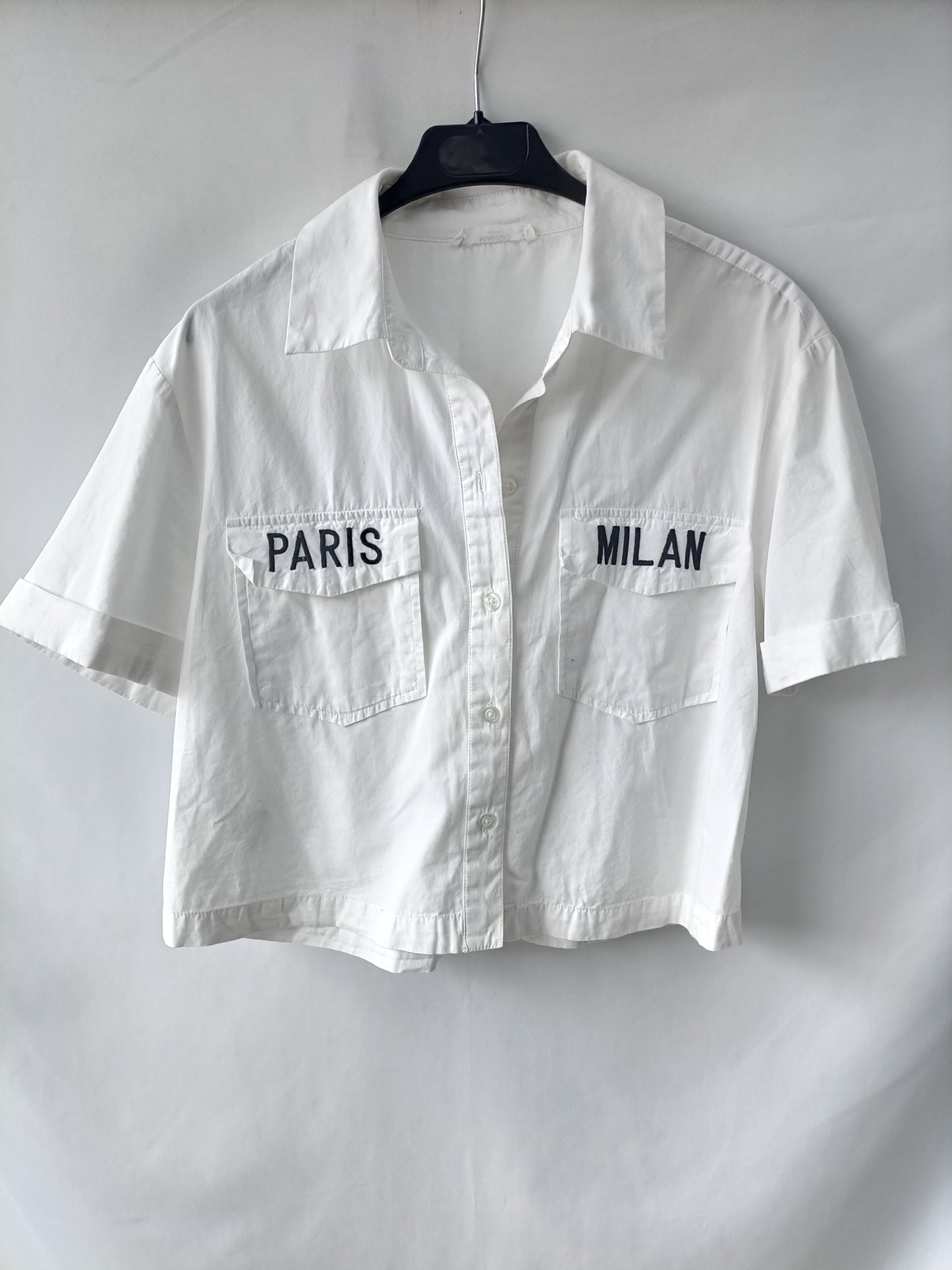 MANGO. White shirt with TM letters