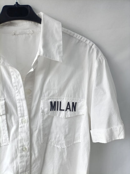 MANGO. White shirt with TM letters