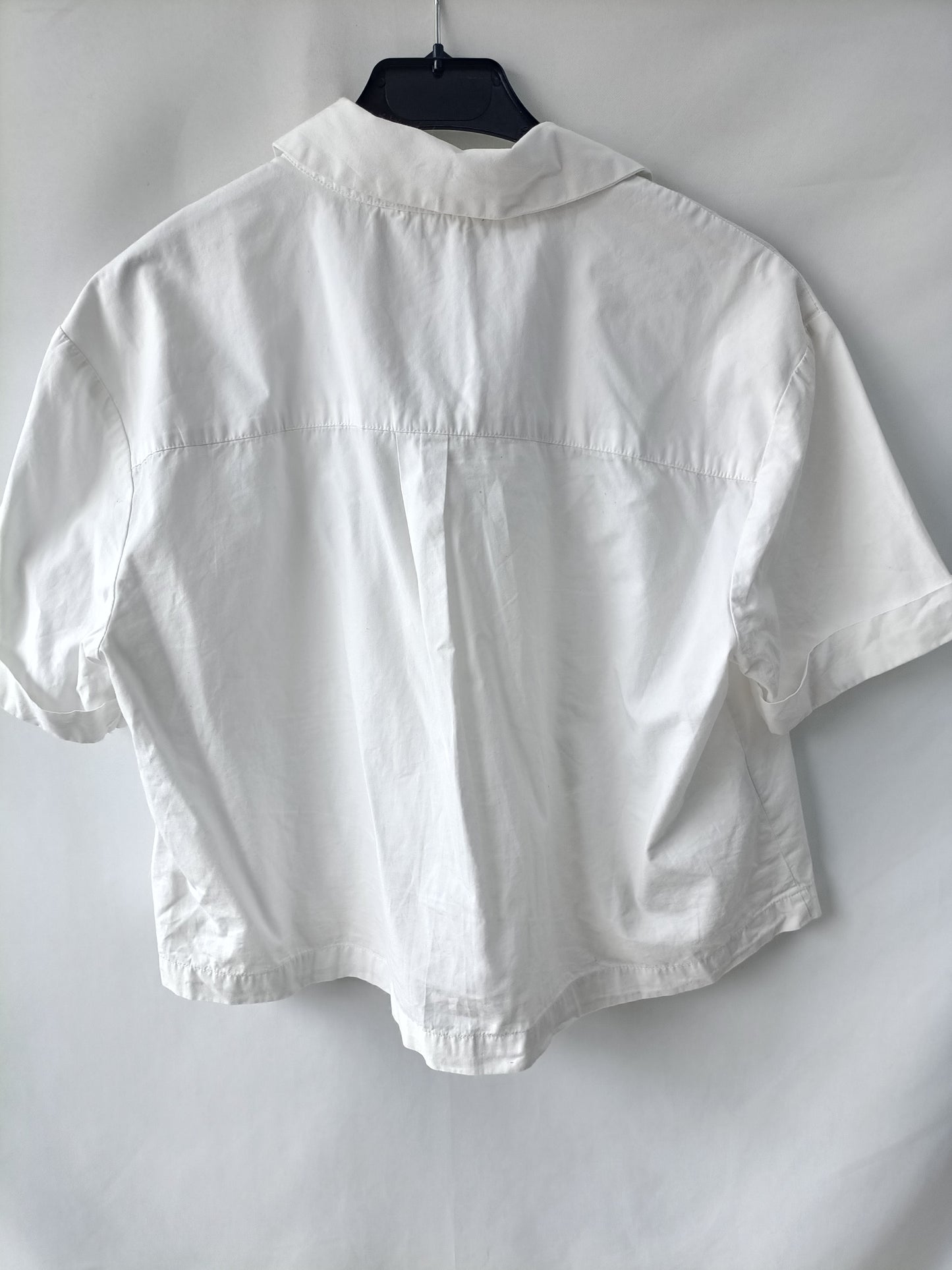 MANGO. White shirt with TM letters