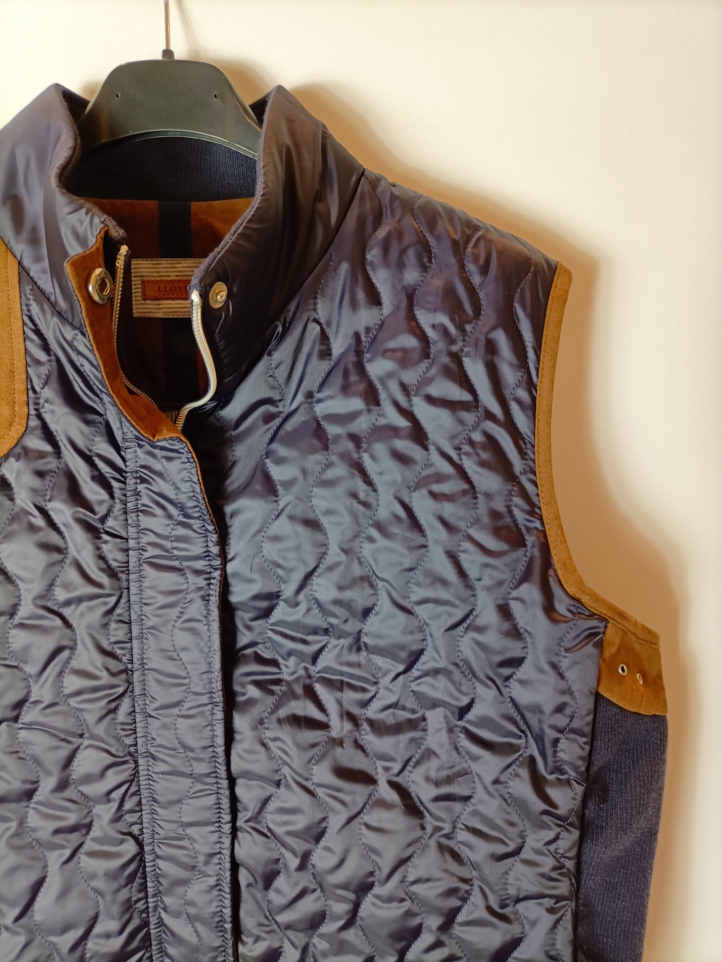 LLOYD'S. Blue down jacket with suede detailing.