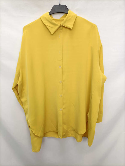 OTRAS. Blusa amarilla oversized T.l/xl