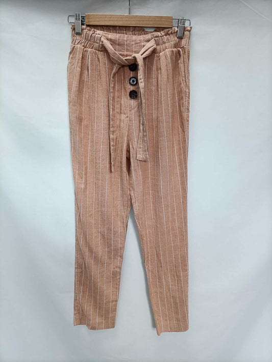 STRADIVARIUS.Pantalones fluidos salmón rayas T.xs