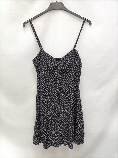 OTRAS.Mono negro flores T.s/m