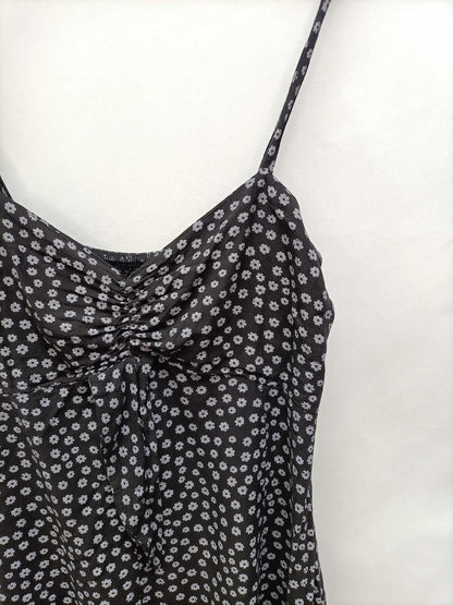 OTRAS.Mono negro flores T.s/m