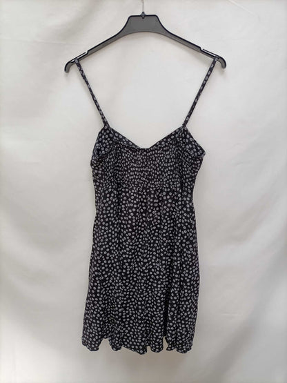 OTRAS.Mono negro flores T.s/m