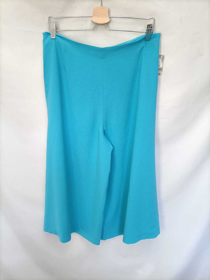 WOMAN DUO. Turquoise palazzo pants S.40