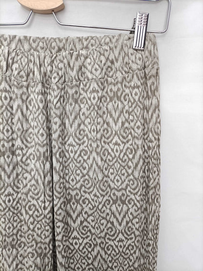 OTRAS.Pantalones elásticos campana beigesT.s/m