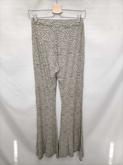 OTRAS.Pantalones elásticos campana beigesT.s/m