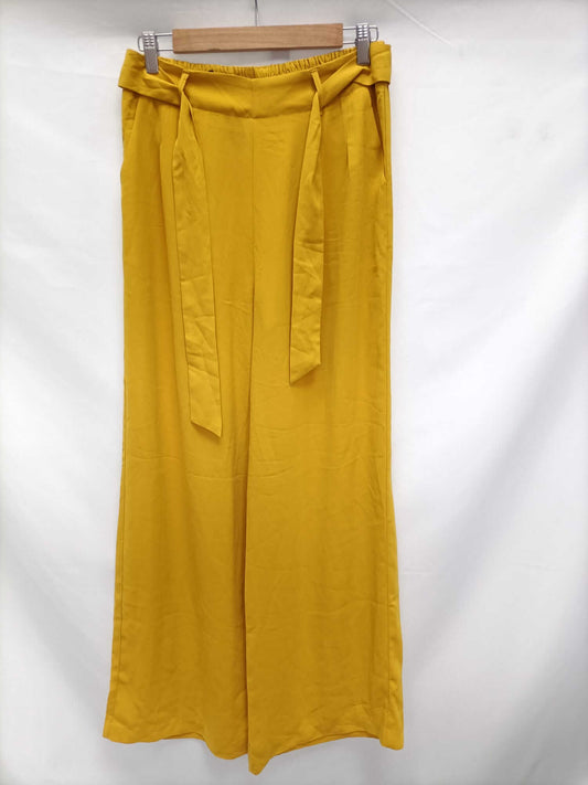 STRADIVARIUS.Palazzo fluidos mostaza apagado T.m