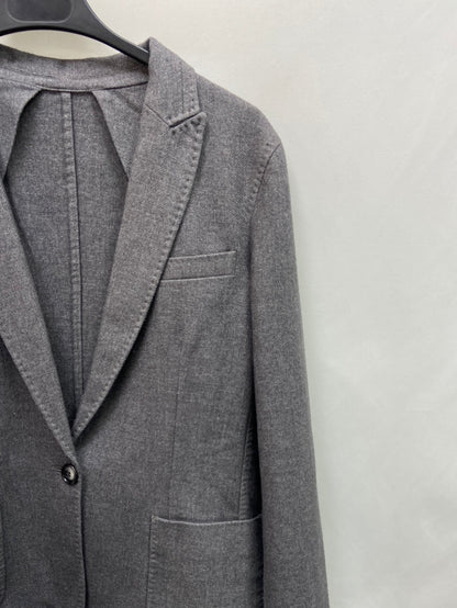 OTRAS.Blazer gris tipo lana T.S