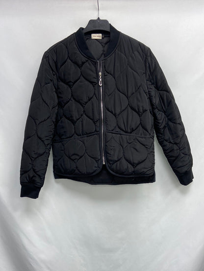 TERIA YABAR.Plumas negro ligero T.M