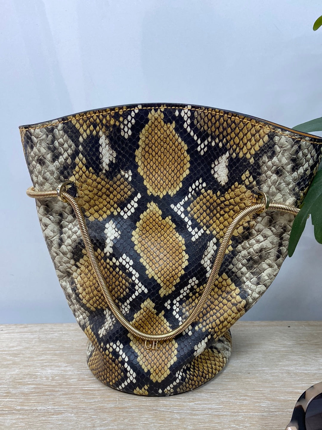GEORGES RECH. Snake print sack bag