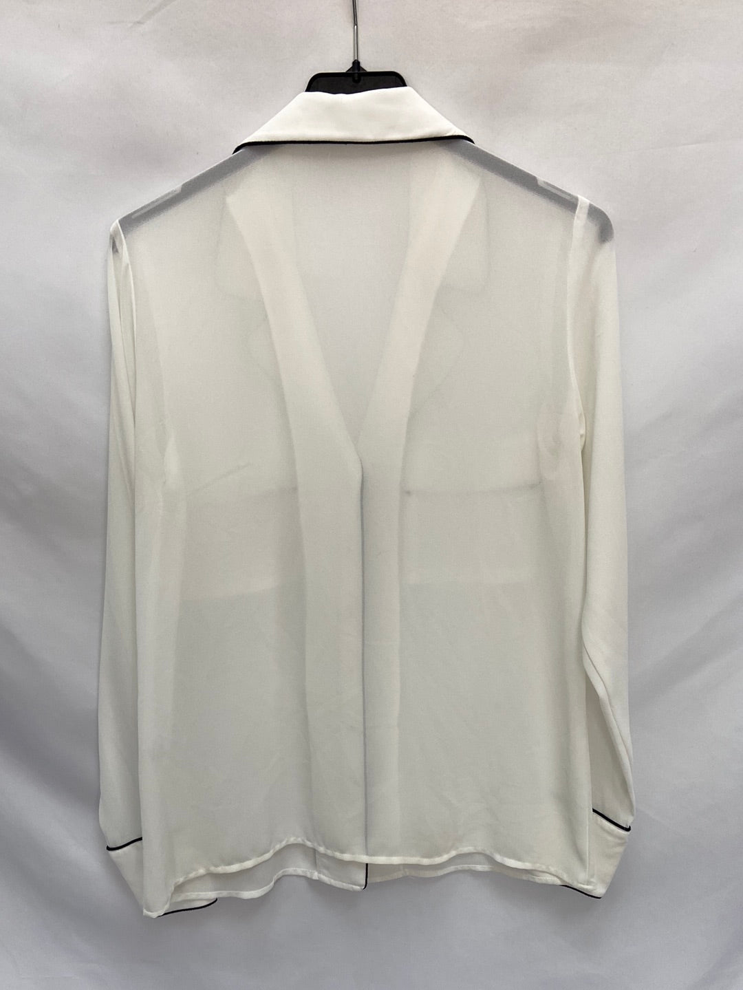 BIOMBO13(BIMANI).Blusa blanca detalles negros T.s