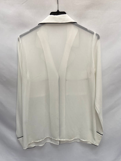 BIOMBO13(BIMANI).Blusa blanca detalles negros T.s