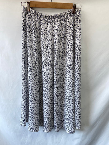 OTRAS.Falda midi flores T.M/L